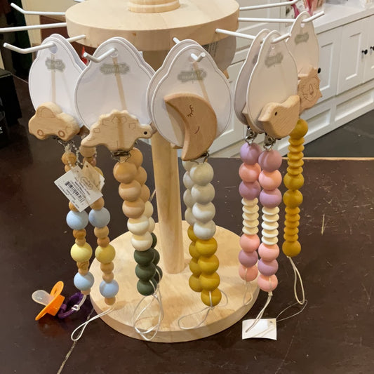 Assorted wooden beaded pacifier clips.