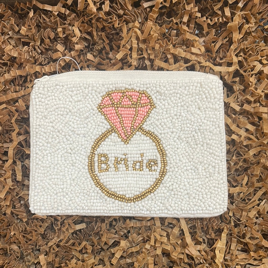 Hand sewn white beaded coin purse featuring "Bride" inside of a ring.