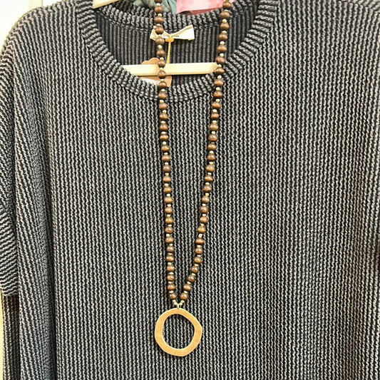 Brown Wood Beaded Necklace with Golden round Charm.