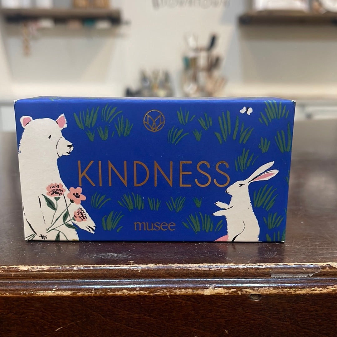 Musee Kindness bar soap. Features a blue background with a white bear and a bunny.