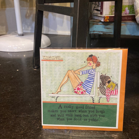 Card with two women in lounge chairs displaying "A really good friend makes you snort when you laugh and will still hang out with you when you do it in public."