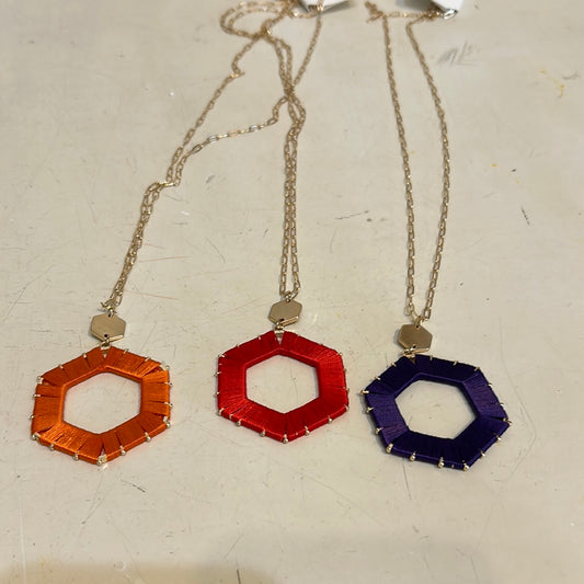 Assorted threaded hexagon game day necklaces.