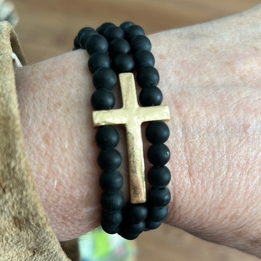 Black semi-precious gold cross bracelet stack.