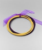 Gold and purple guitar string bracelets.