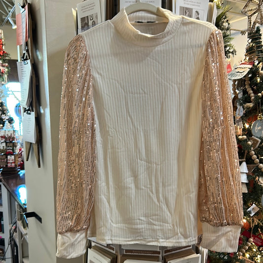 Cream ribbed mock neck top with sequin sleeves.