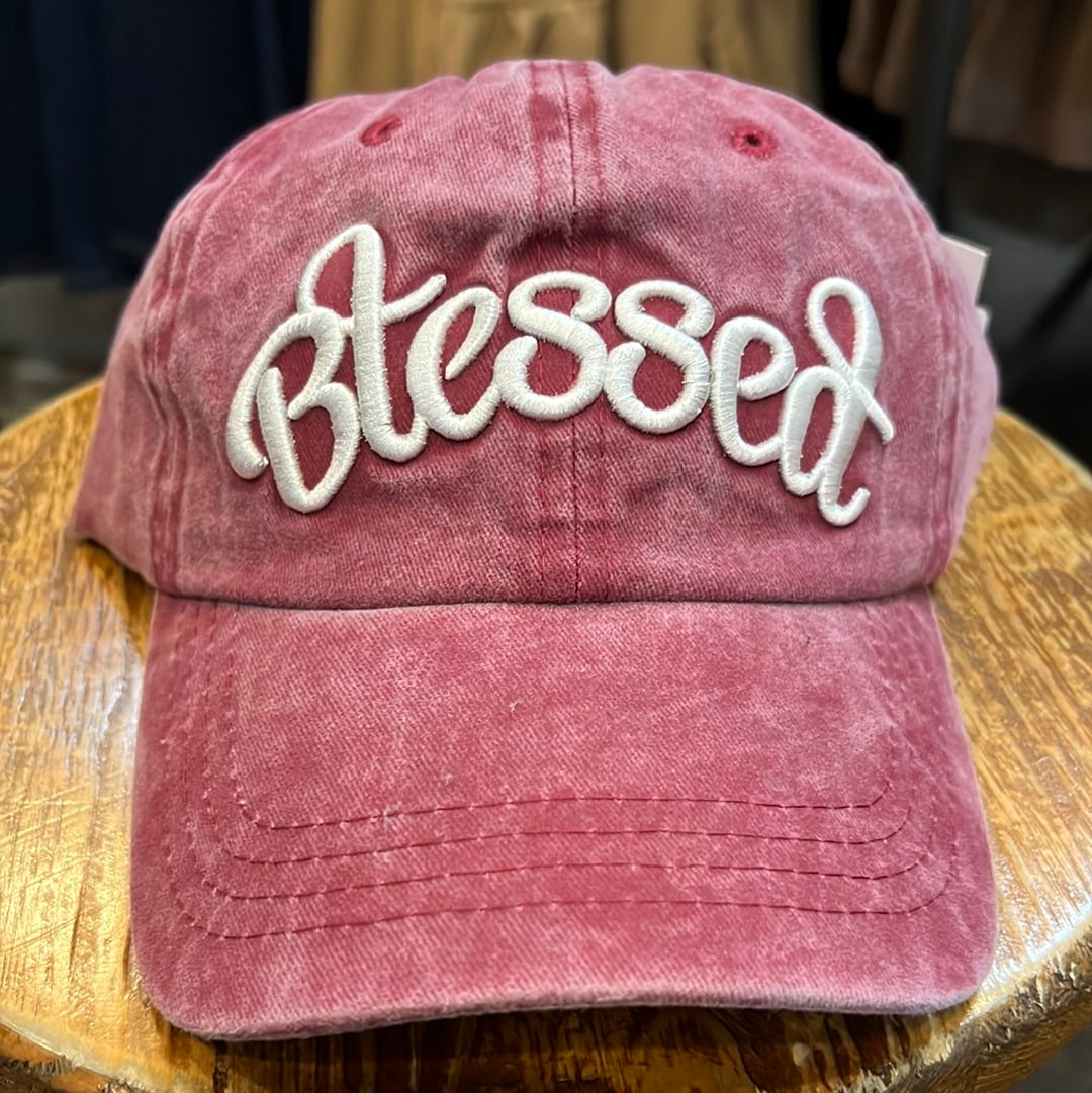Red women's hat featuring "Blessed".