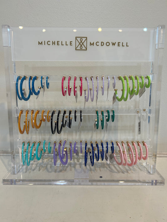 Acrylic hoop earrings in assorted colors.