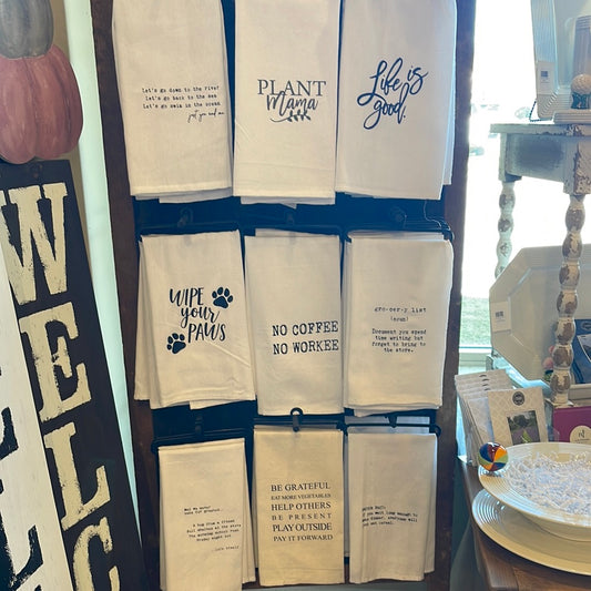 Assorted hand stamped dish towels.