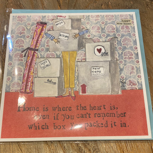 Card with moving boxes featuring “Home is where the heart is, even if you can’t remember which box you packed it in.”