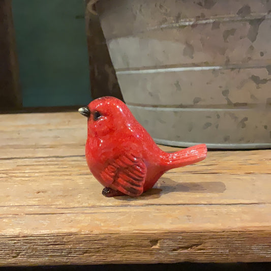 Small red cardinal glass figurine.