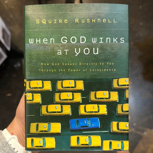 Book with yellow cars and one blue car titling "When GOD Winks At You".