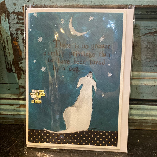 Card with a white dog sitting under a crescent moon featuring “There is no greater earthly privilege than to have been loved by a dog.”