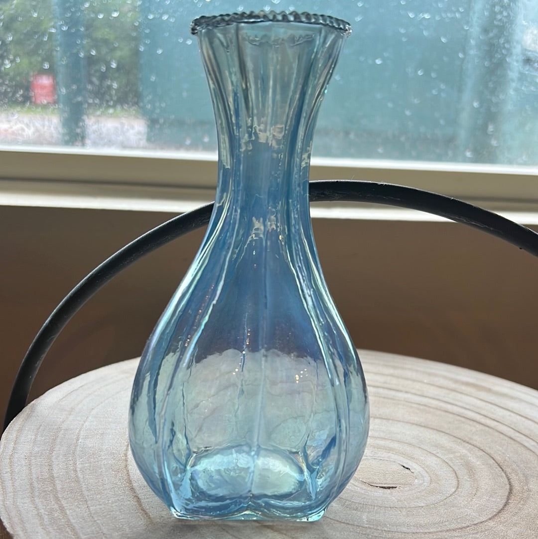 Small blue transparent vase.
