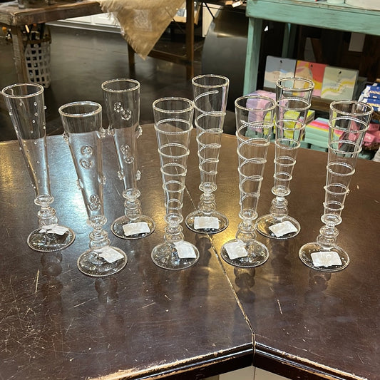 Assorted beaded champagne glasses.