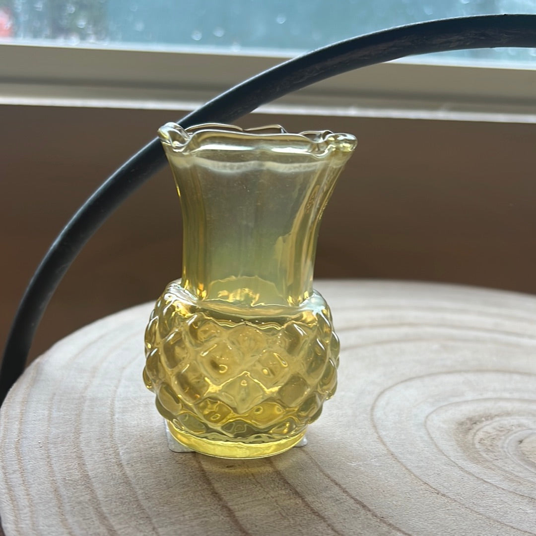 Small yellow transparent vase.