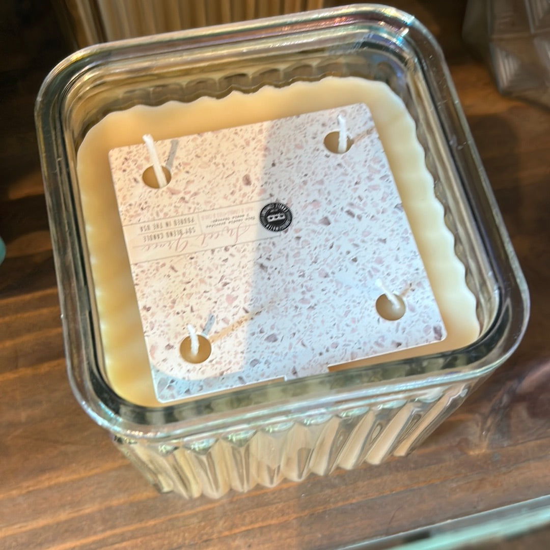 Candle in a Square-shaped Iridescent Clear Glass Vessel.