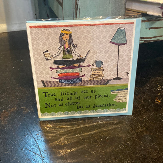 Card with a woman balancing work and home in her living room. “True friends see us and all of our pieces, Not as a clutter but as decoration.” 