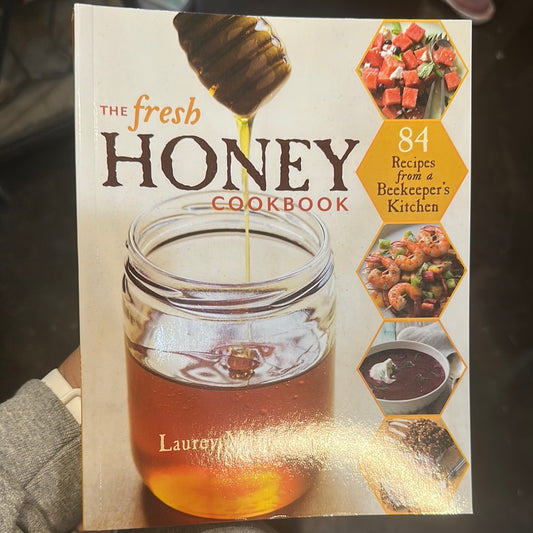 Book with jar of honey titling "The Fresh Honey Cookbook".