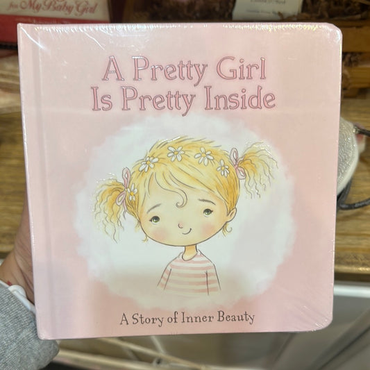 Cover is light pink, with outlined pink lettering, featuring a young girl with pigtails and flowers in her blonde hair.
