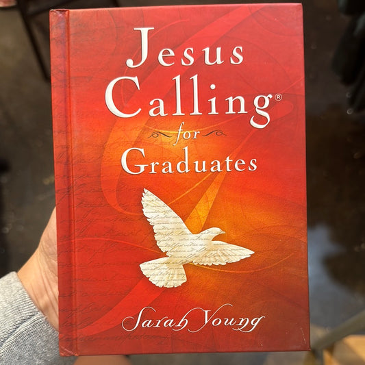 Book with orange cover with a white dove featuring "Jesus Calling for Graduates; Sarah Young".
