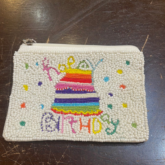 White beaded coin purse displaying a multicolored birthday cake and "Happy Birthday".
