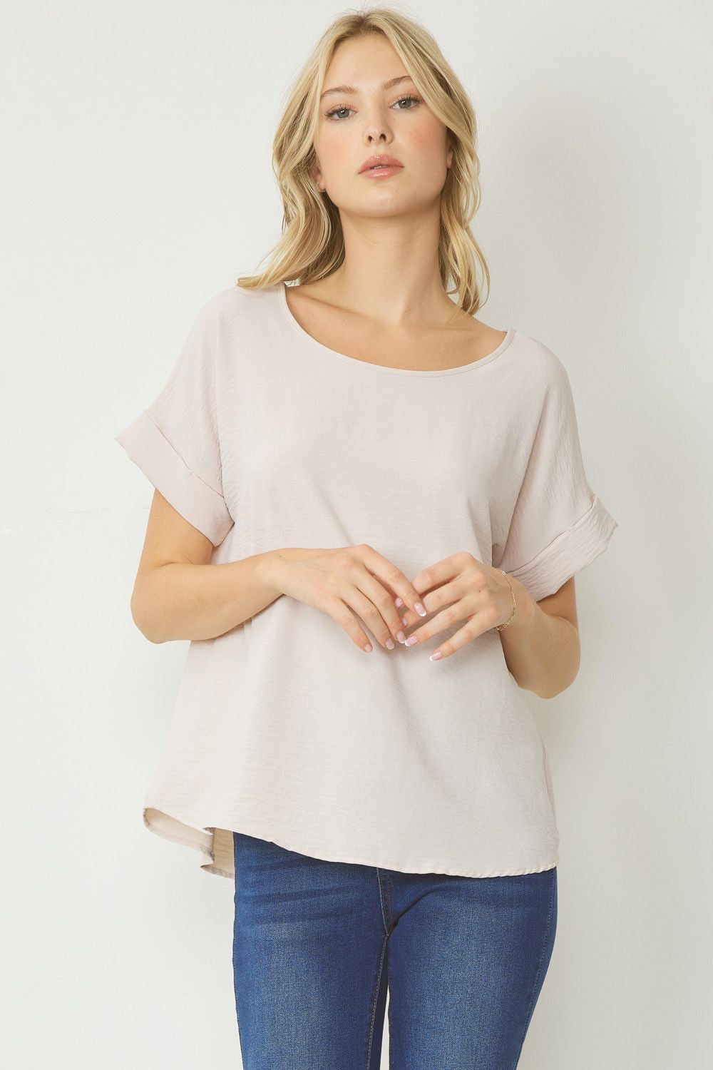 Oatmeal scoop-neck top featuring permanent rolled sleeve detail and an asymmetrical hem.