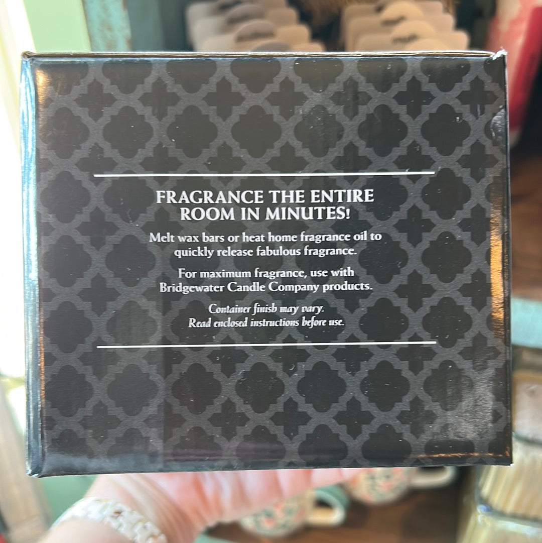 Side of box of wax warmer. "Fragrance the entire room in minutes." Wax warmer instructions.