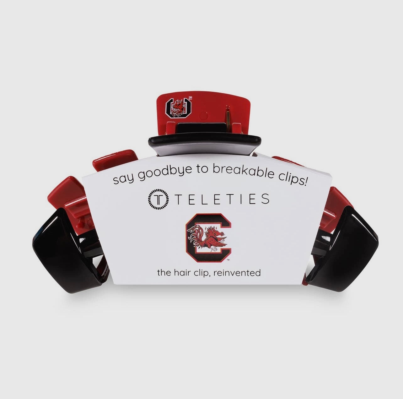 University of South Carolina Collegiate Teletie Claw Clip in garnet and black. Side view with packaging.