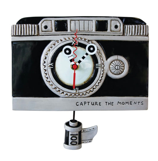 Clock designed like a camera displaying "Capture the Moments".