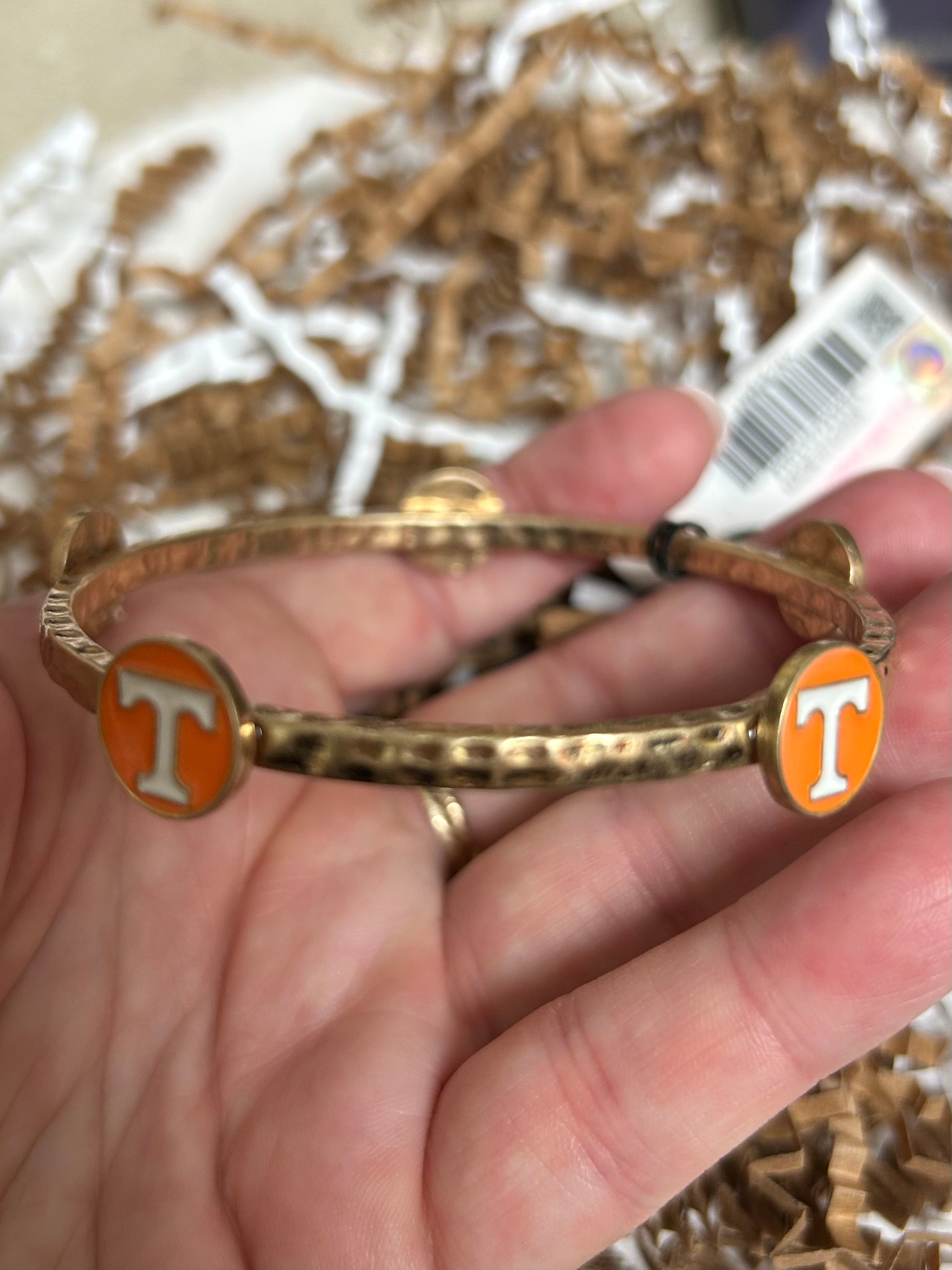 Gold Claudia bangle with Tennessee Volunteers logo.