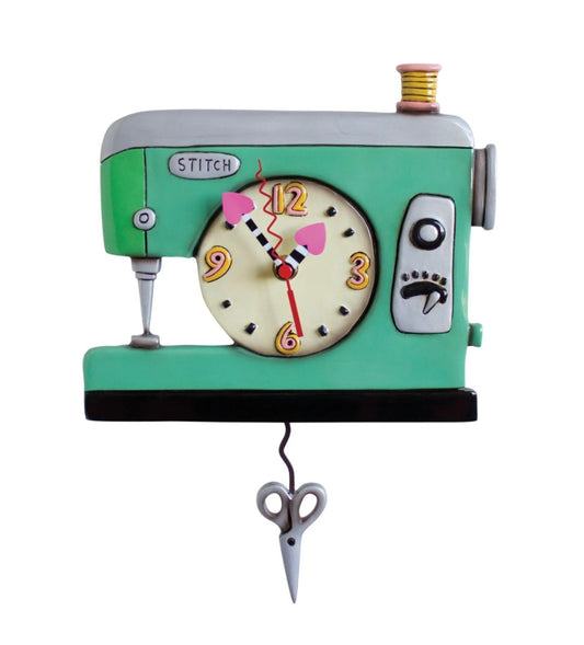 Clock designed in the shape of a sewing machine with scissors.