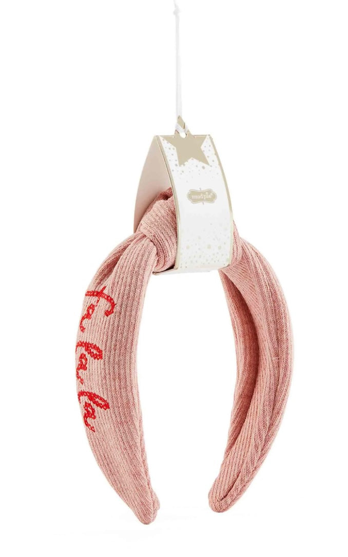 Pink Christmas Embroidered Topknot Headband with red lettering.