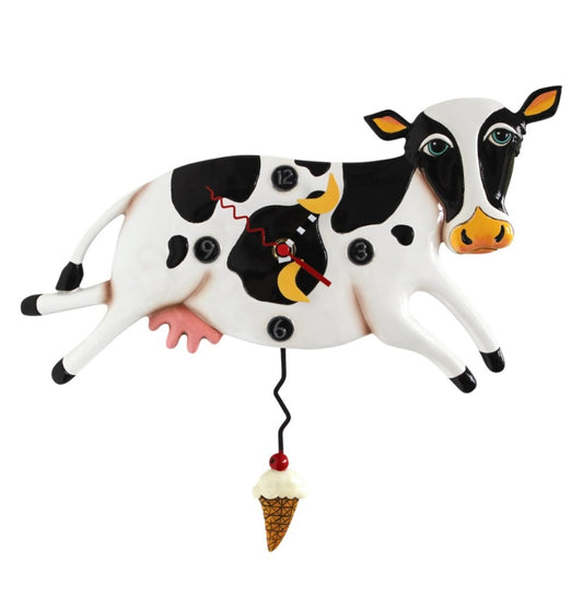 Clock shaped like a cow with moons as hands.
