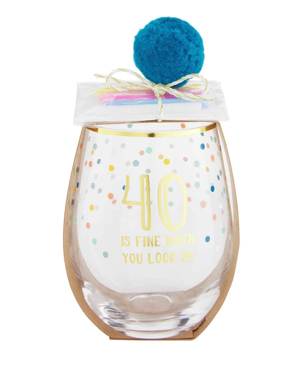 Blue stemless wine glasses with confetti details that says "40 is fine when you look 29".