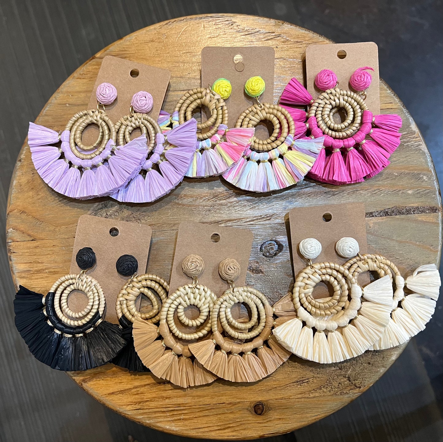 Assorted raffia tassel bamboo earrings.