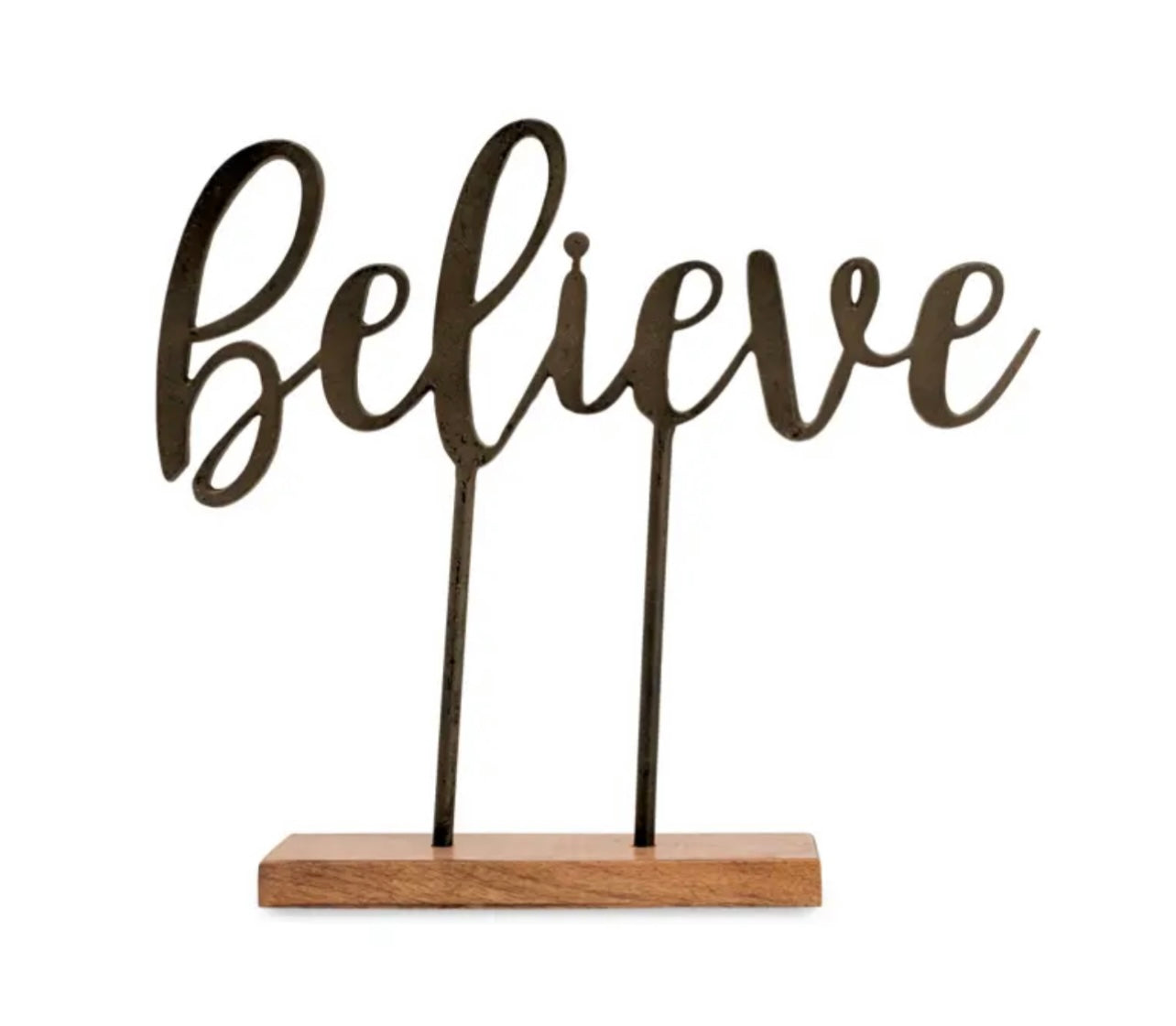 Cast iron word art with wooden base featuring "Believe".