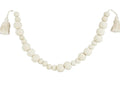 White beaded garland with tassels.