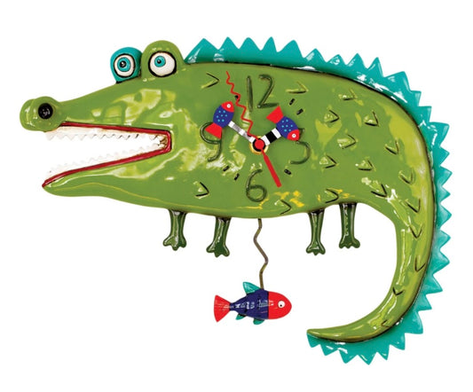 Green and blue, cartoon alligator with red and blue fish hands.