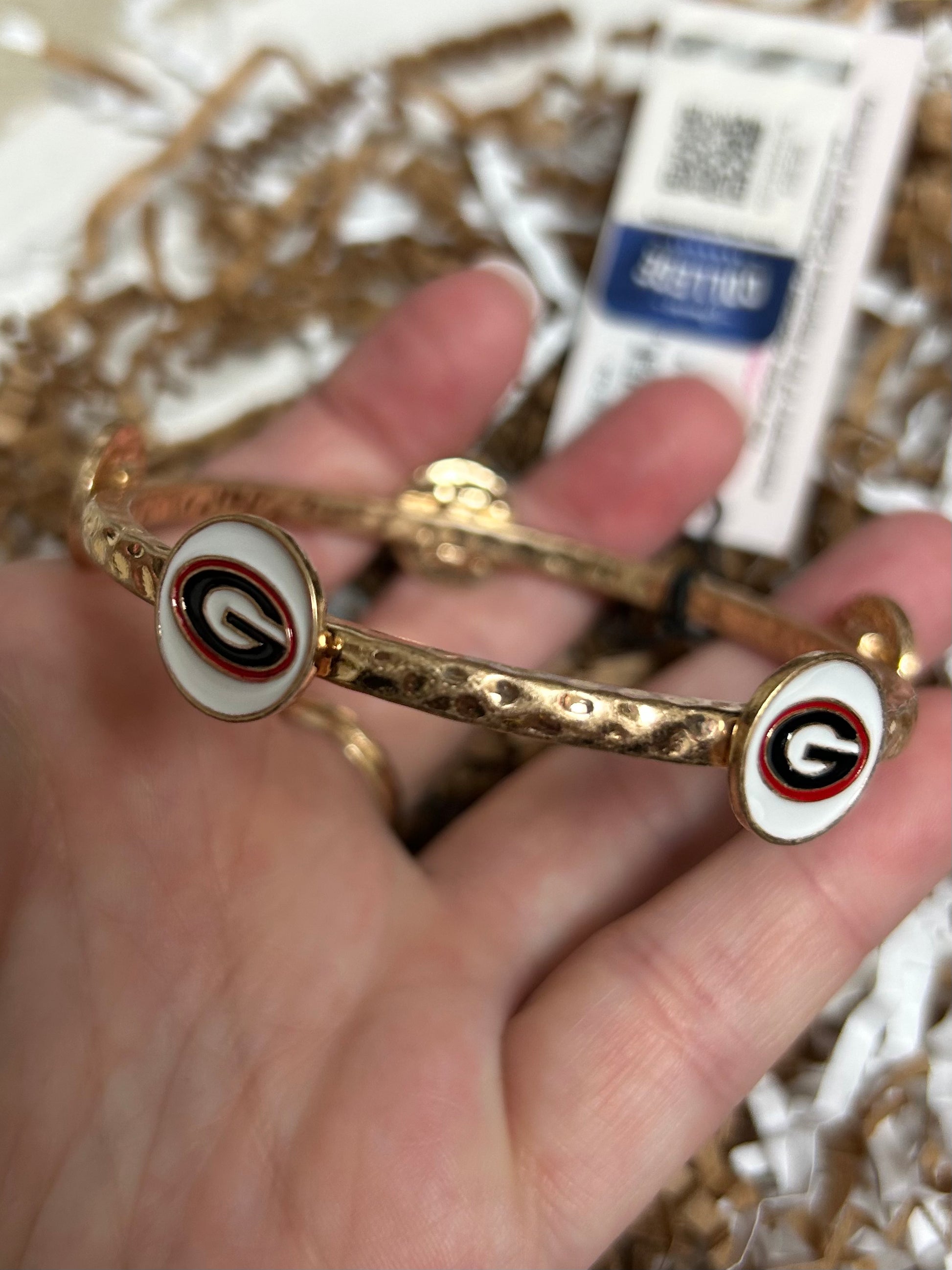 Gold Claudia bangle with Georgia Bulldogs logo.