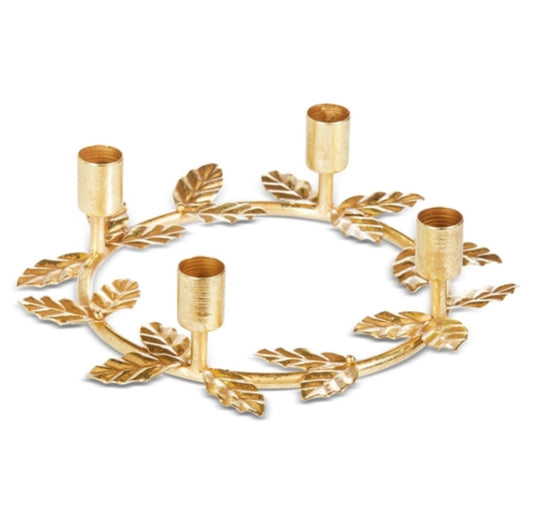 Ring of golden holly leaf as a candle holder.