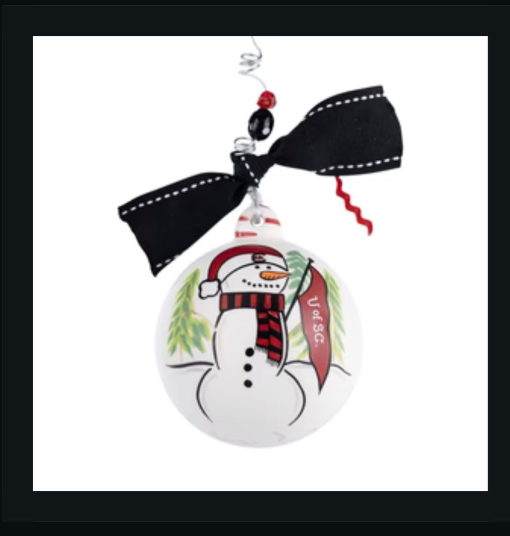 Christmas ornament featuring a snowman with a USC flag, hat, and scarf.