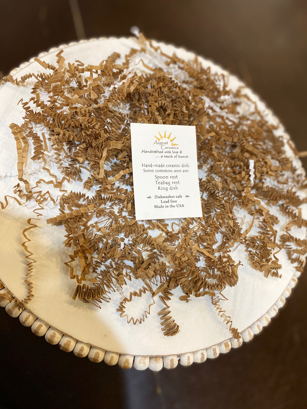 Note card with information about handmade ceramic dishes.
