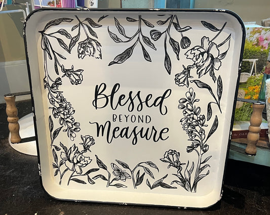 White tray with black outlines flowers featuring "Blessed beyond measure" in black lettering.