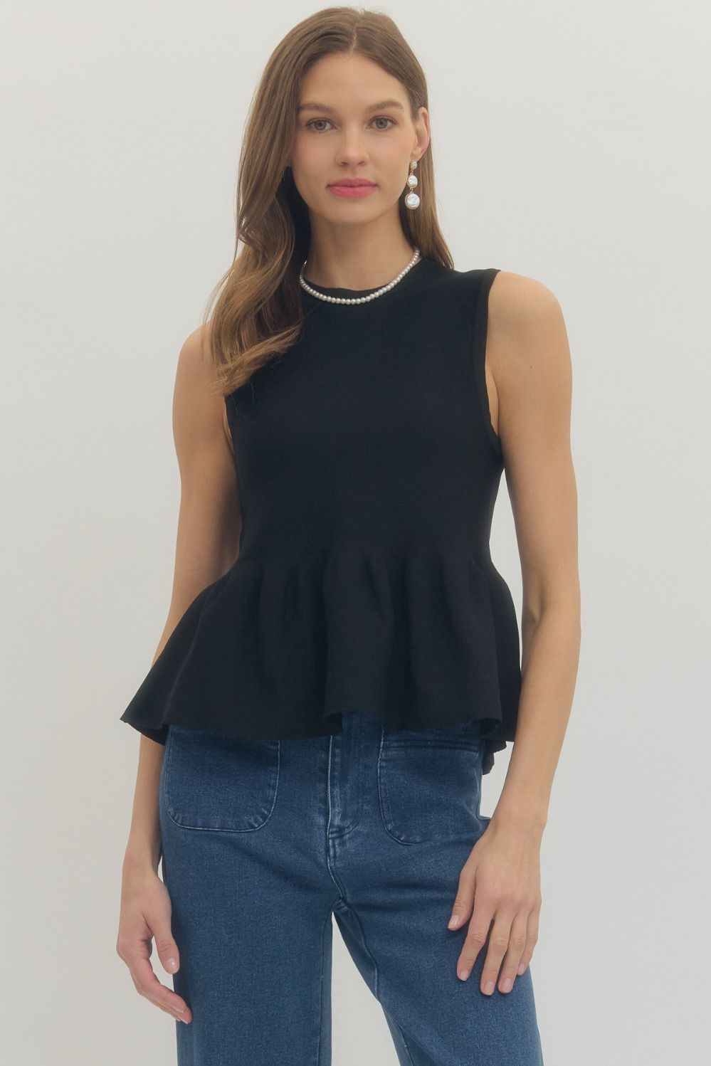 Solid sleeveless peplum top