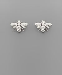 Small stud earrings in the shape of a bee. Silver in color.