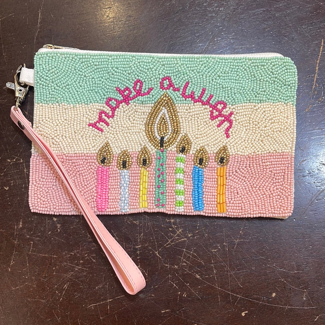 Beaded striped birthday coin bag with a wristlet that says "Make a wish" with candles.