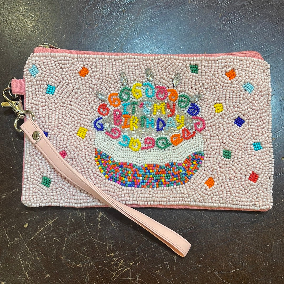 Beaded birthday coin bag with a wristlet that says "It's my birthday" with a cake.