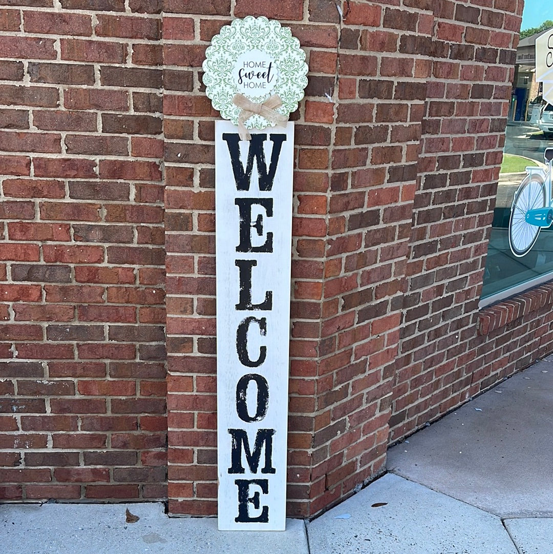 White Wooden Welcome Sign with wreath.