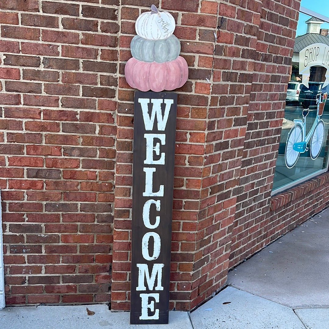 Brown Wooden Welcome Sign with pumpkins.