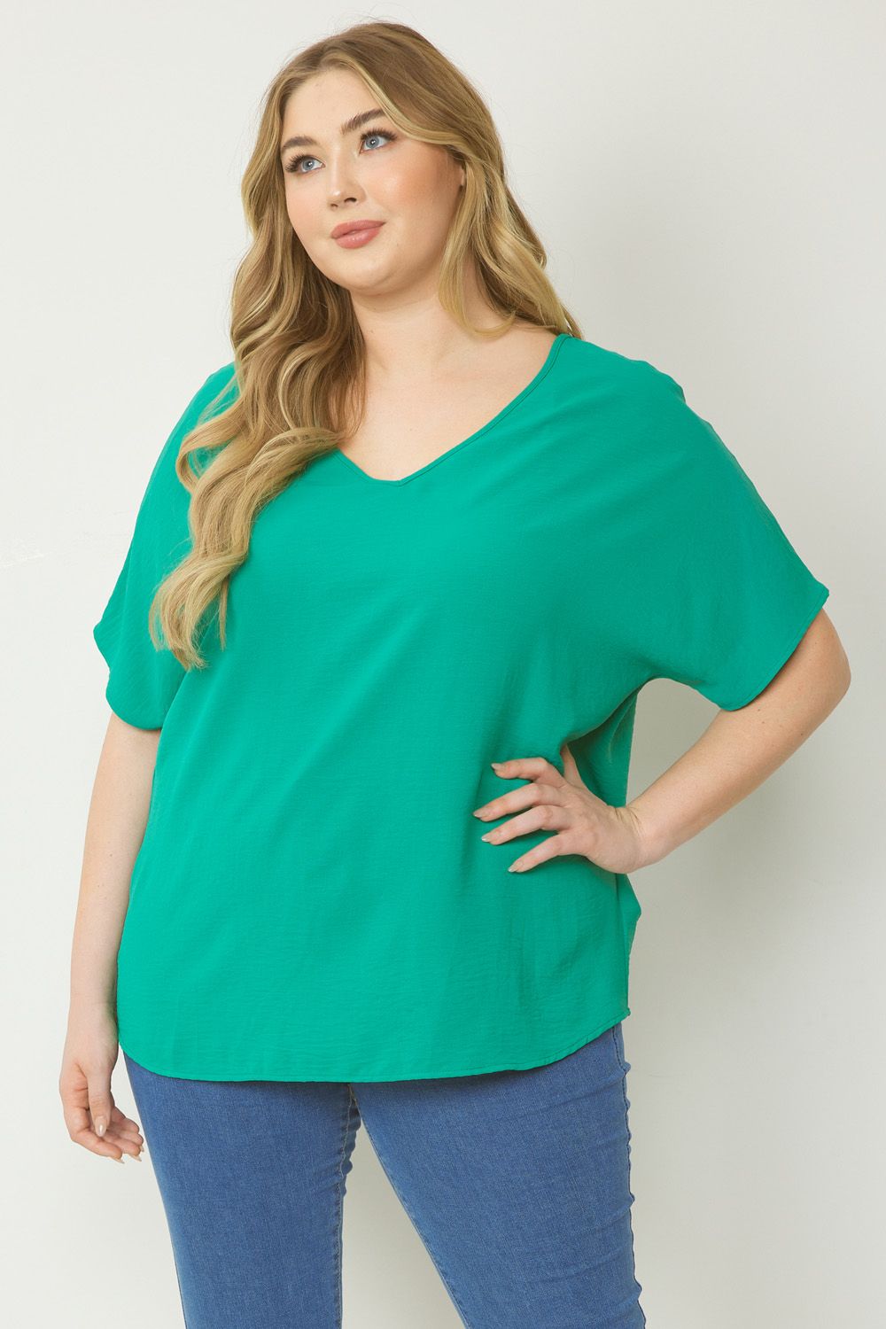 Women's green basic v-neck shirt.